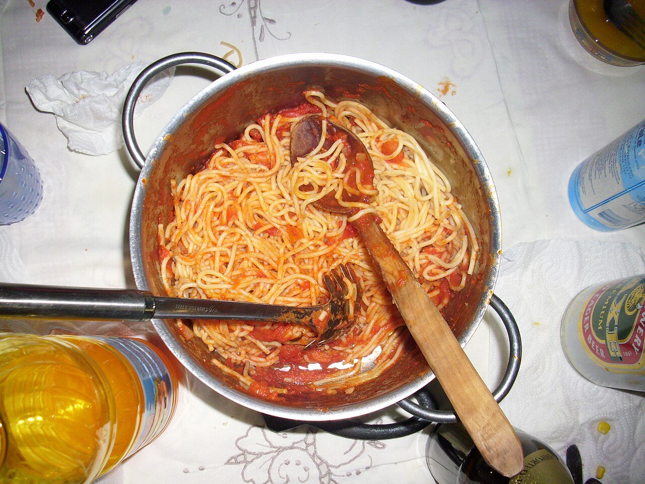 Creamy tomato pasta with basil in a bowl.