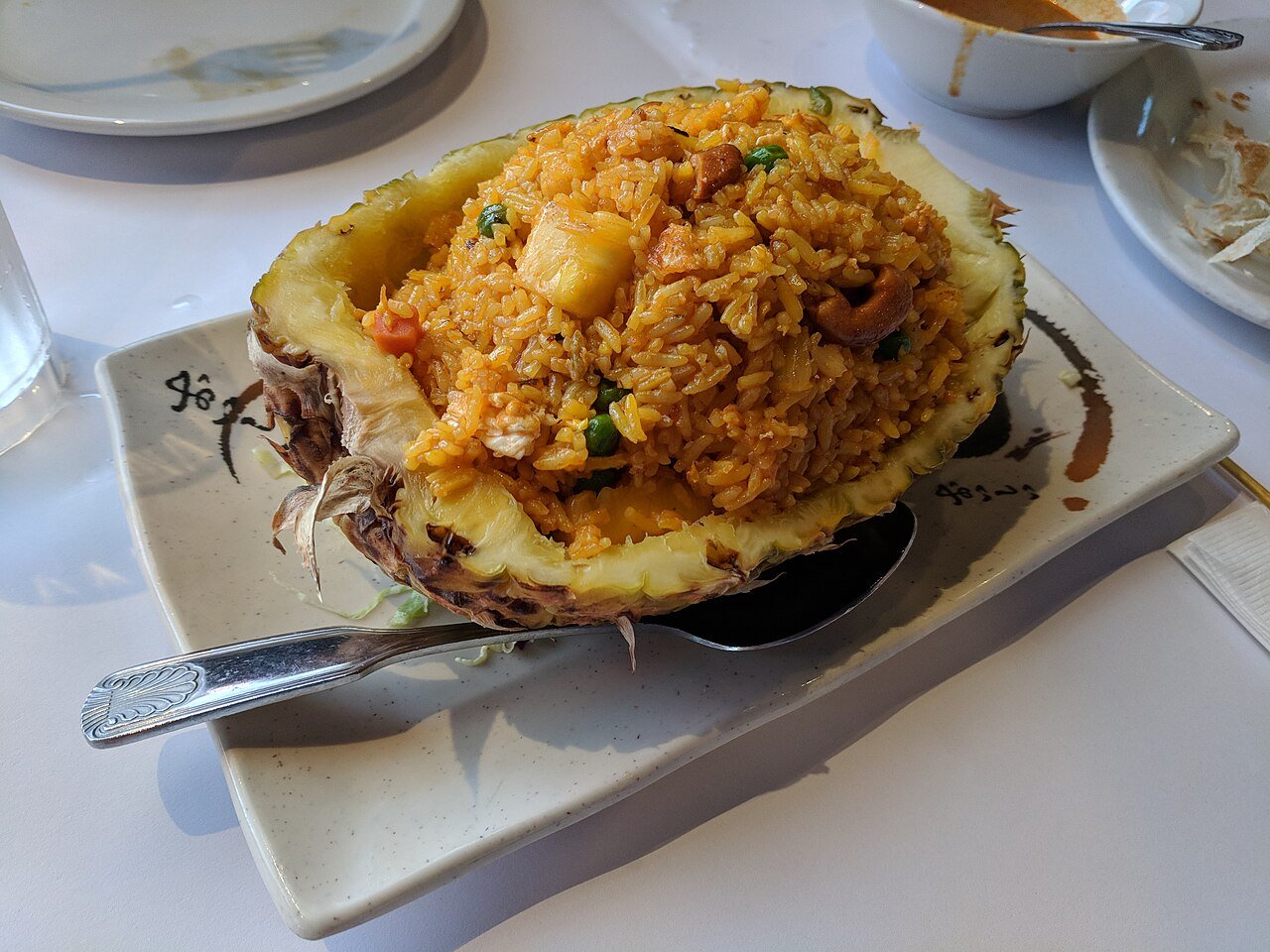 Egg fried rice with vegetables in a bowl.