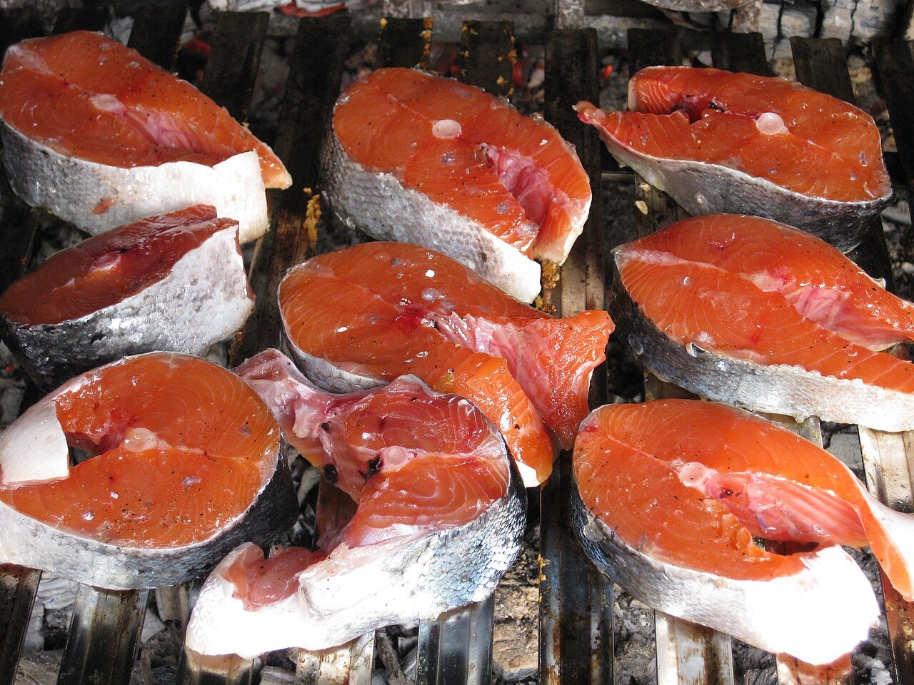 Pan-seared salmon fillet with lemon and herbs.