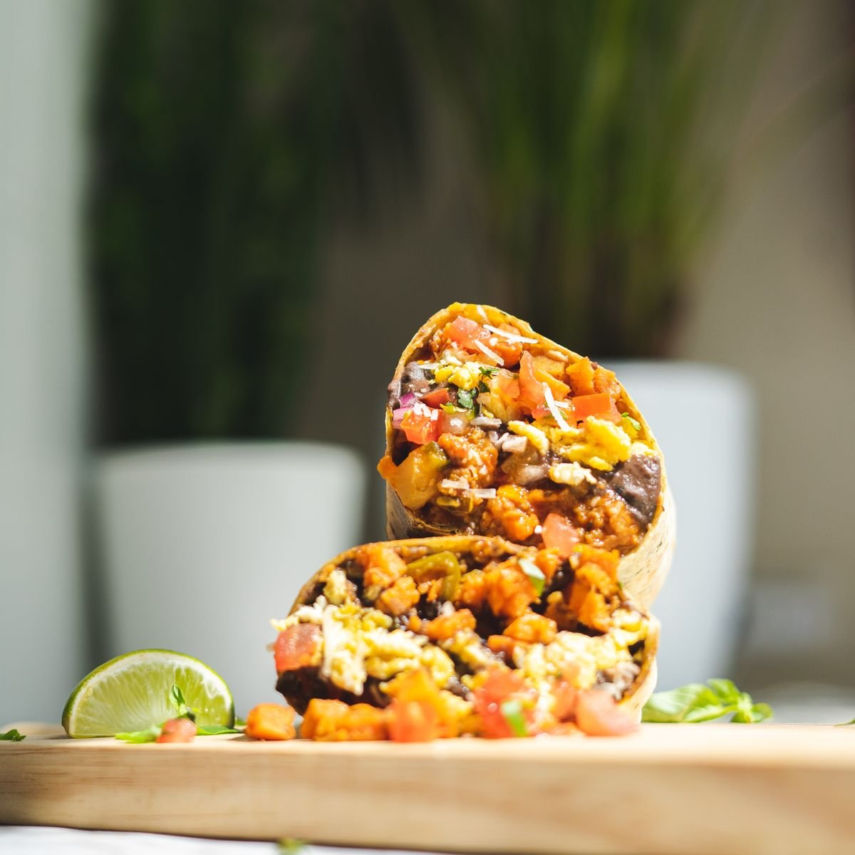 Golden toasted bean and cheese burritos cut open showing melty filling.