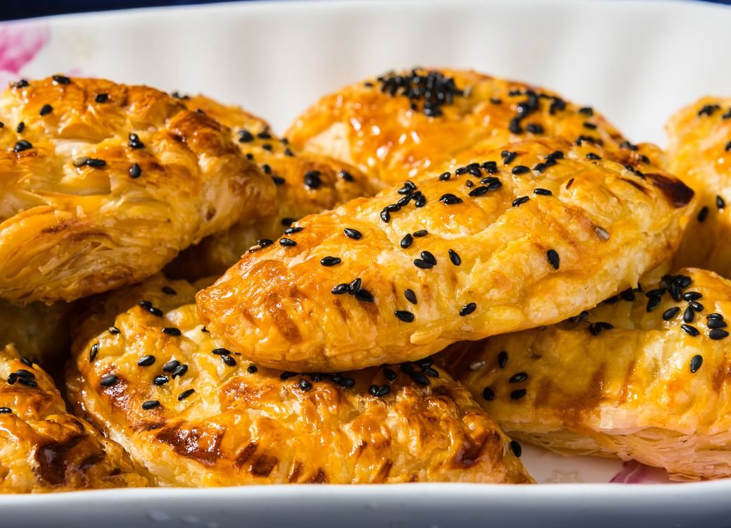 A golden chicken pot pie with flaky puff pastry crust.